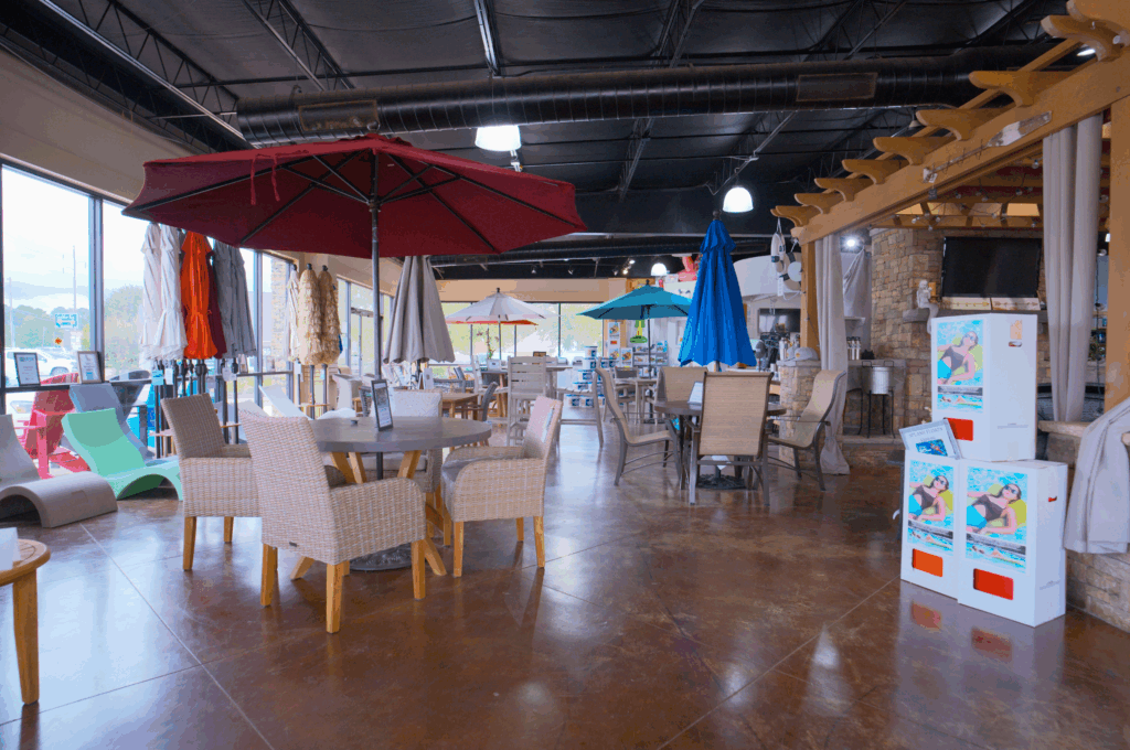 Display showing several Galtech umbrellas in different sizes and colors - perhaps showing both table umbrellas and larger freestanding models. Include visible branding or quality details that demonstrate why these umbrellas are superior to big-box store options. Should emphasize the variety available in the BOGO promotion.