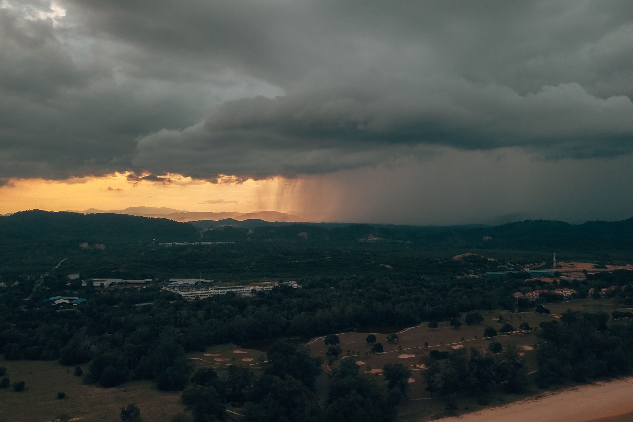 Storm clouds over a Middle Georgia backyard, a reminder to protect your pool from storms
