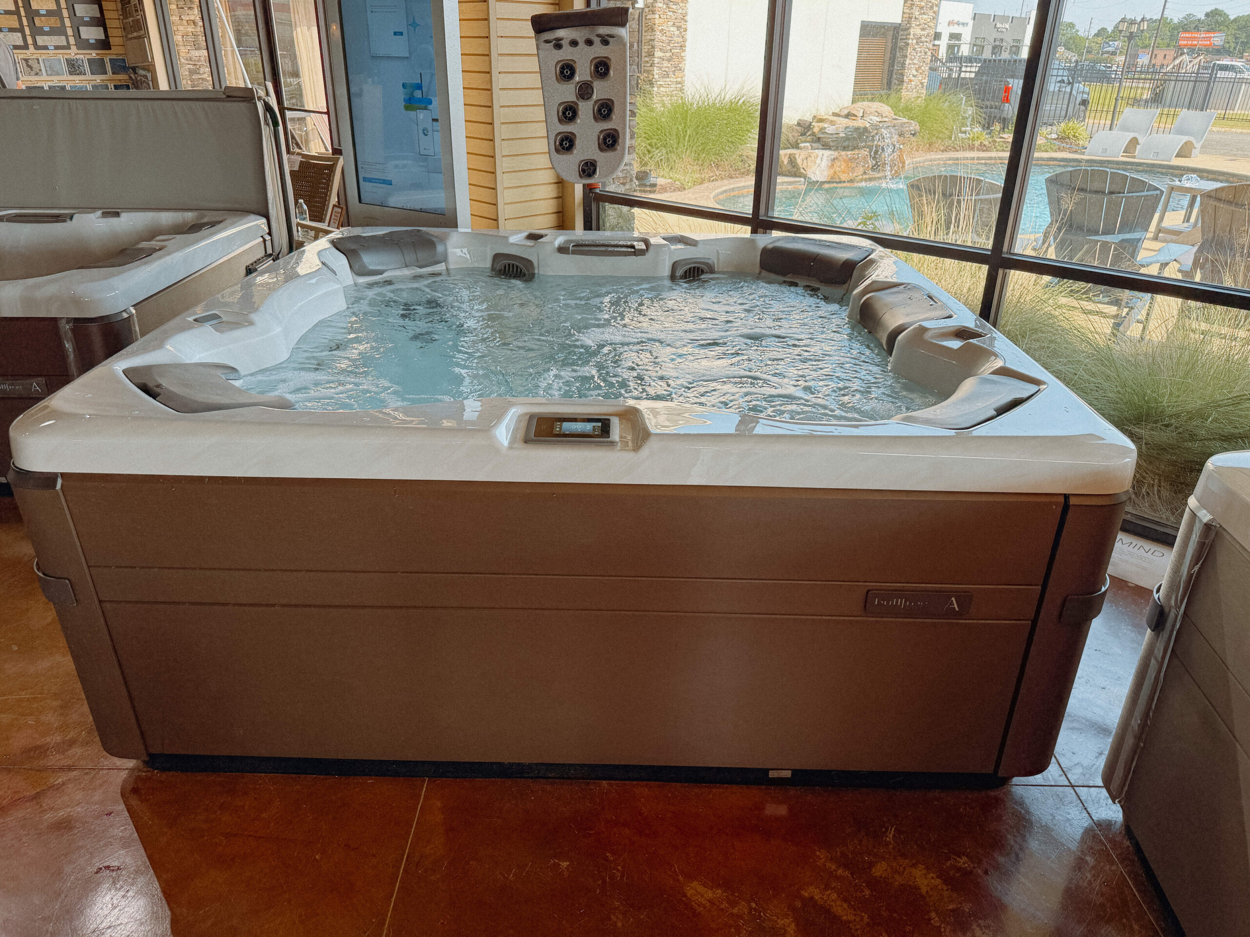 Backyard hot tub and spa at a Warner Robins, Georgia home from Mid State Pools