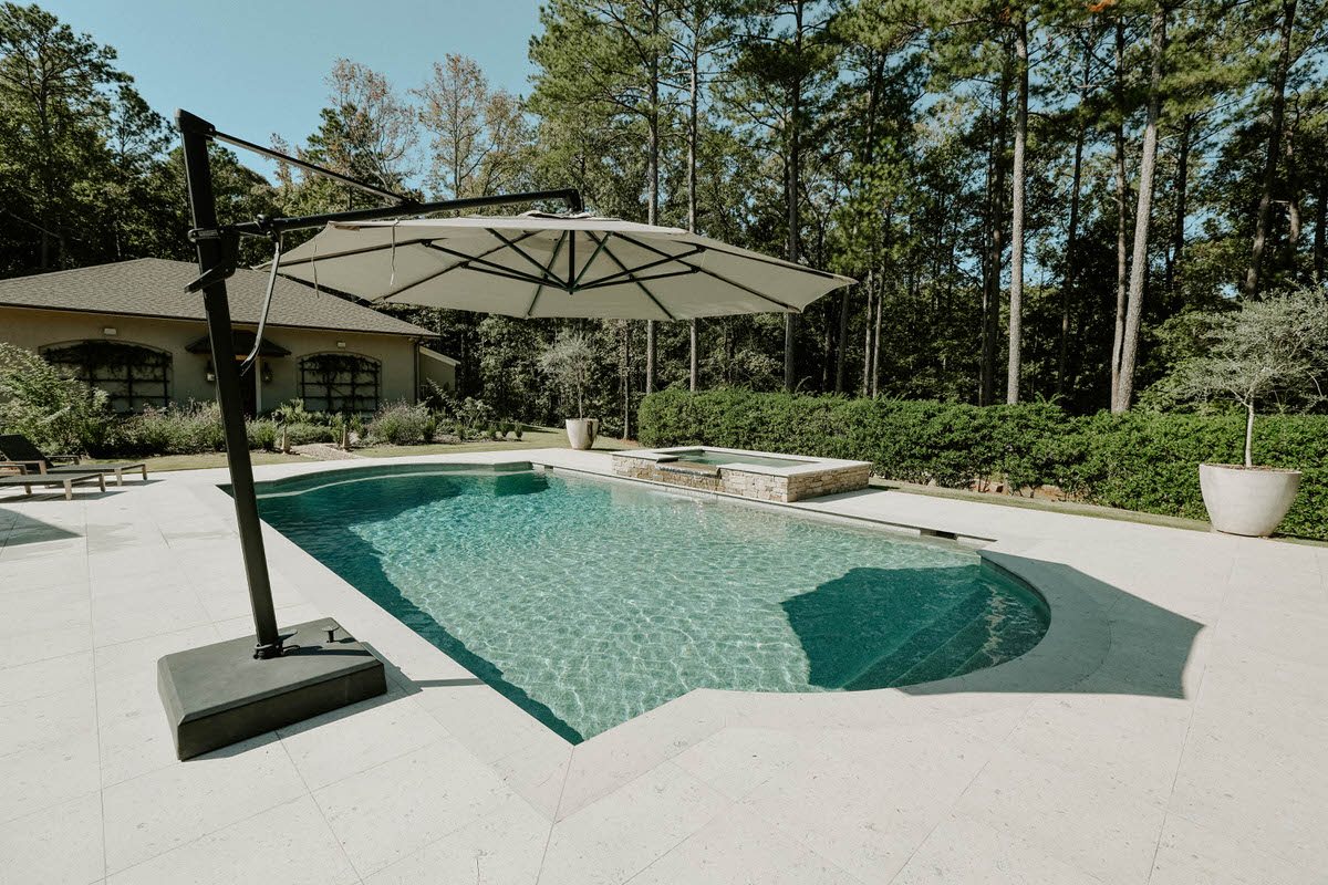 Clean, clear backyard swimming pool free of algae at a Warner Robins, Georgia home