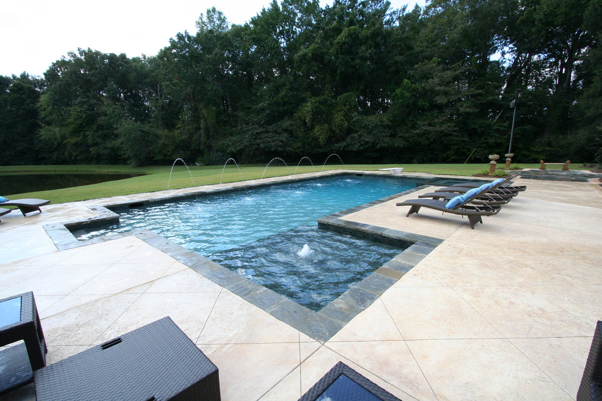 Pool chemistry - testing swimming pool water with chemical test kit for pH, chlorine and water balance