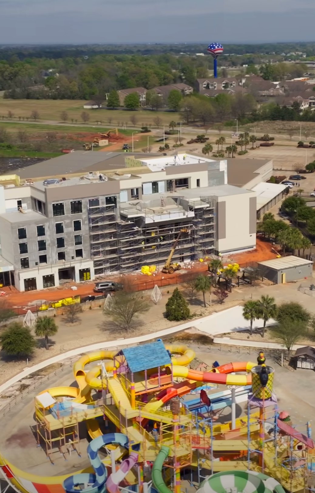 Aerial view of the Rigby's Water World hotel and infinity edge pool construction site by Mid State Pools