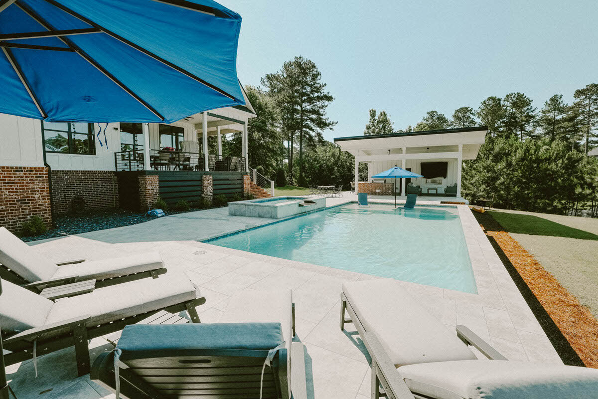 Modern in-ground pool with deck loungers ready for spring opening in Middle Georgia